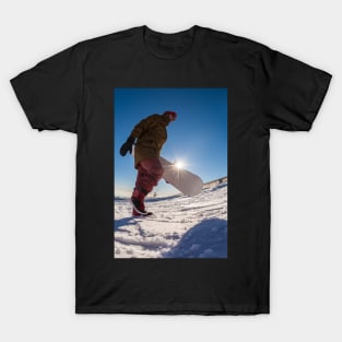 Snowboarder walking against blue sky T-Shirt